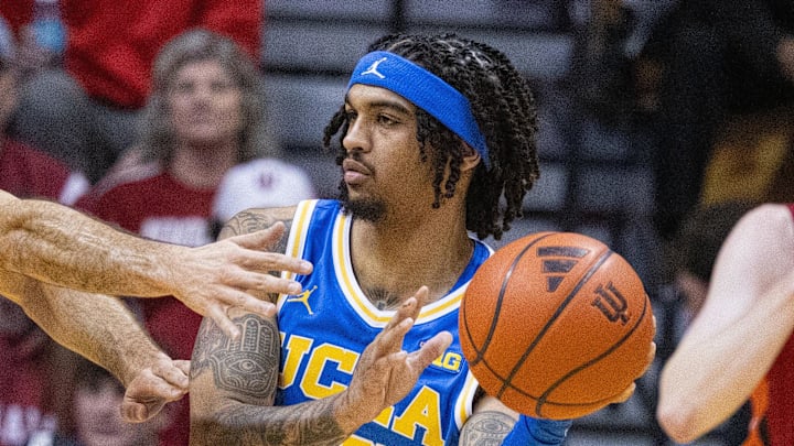 Feb 14, 2025; Bloomington, Indiana, USA; UCLA Bruins guard Skyy Clark (55) passes the ball while Indiana Hoosiers guard Anthony Leal (3) defends in the first half at Simon Skjodt Assembly Hall. Mandatory Credit: Trevor Ruszkowski-Imagn Images