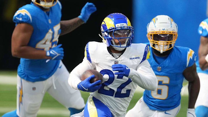 Aug 16, 2025; Inglewood, California, USA; Los Angeles Rams running back Blake Corum (22) carries the ball against the Los Angeles Chargers in the first half at SoFi Stadium. Mandatory Credit: Kirby Lee-Imagn Images