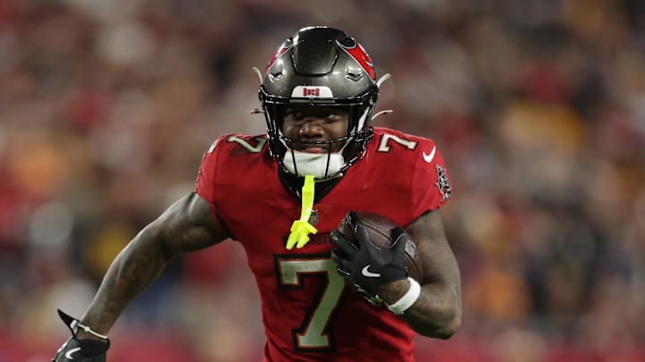 Tampa Bay Buccaneers running back Bucky Irving runs during the fourth quarter of a NFC wild card playoff against the Washington Commanders.