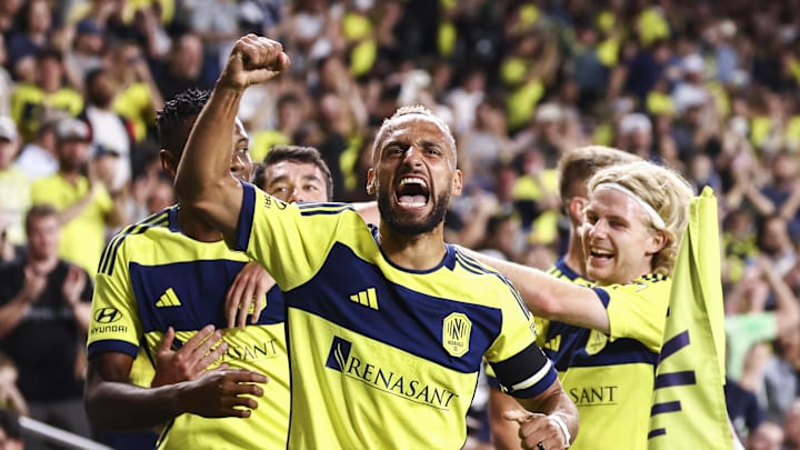 Hany Mukhtar (center) celebrates a goal in Nashville SC's 7–2 win over Chicago Fire FC