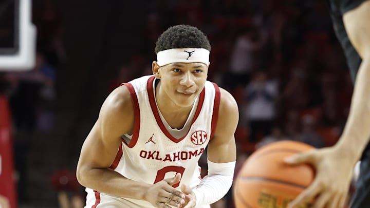 Feb 1, 2025; Norman, Oklahoma, USA; Oklahoma Sooners guard Jeremiah Fears (0) reacts as Vanderbilt Commodores guard Tyler Tanner (3) brings the ball downcourt during the second half at Lloyd Noble Center. Mandatory Credit: Alonzo Adams-Imagn Images