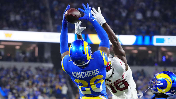 Dec 28, 2024; Inglewood, California, USA; Los Angeles Rams safety Kamren Kinchens (26) intercepts a pass intended for Arizona Cardinals wide receiver Marvin Harrison Jr. (18) in the second half at SoFi Stadium. Mandatory Credit: Kirby Lee-Imagn Images Dec 28, 2024; Inglewood, California, USA; Los Angeles Rams safety Kamren Kinchens (26) intercepts a pass intended for Arizona Cardinals wide receiver Marvin Harrison Jr. (18) in the second half at SoFi Stadium. Mandatory Credit: Kirby Lee-Imagn Images