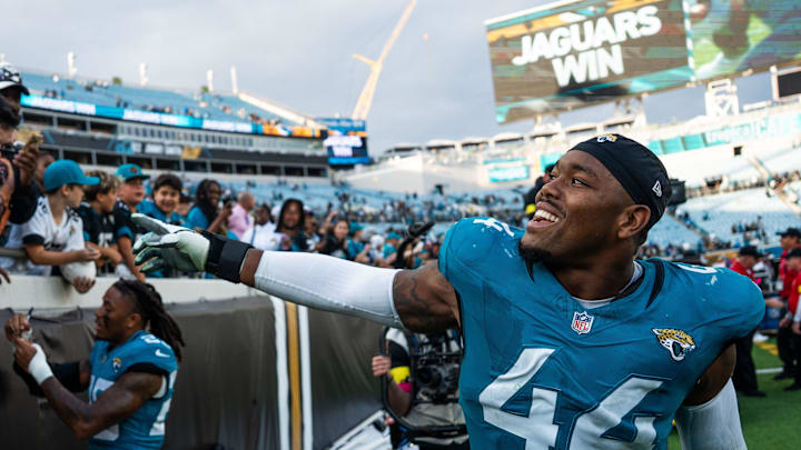 Jacksonville Jaguars defensive end Travon Walker (44) celebrates with fans at EverBank Stadium, Sunday, Dec. 14, 2025, in Jacksonville, Fla. The Jaguars defeated the Jets 48-20. [Doug Engle/Florida Times-Union]