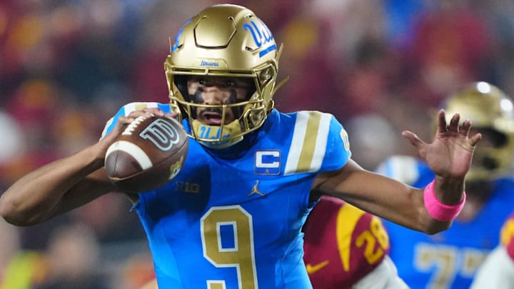Nov 29, 2025; Los Angeles, California, USA; UCLA Bruins quarterback Nico Iamaleava (9) carries the ball against the Southern California Trojans in the first half at United Airlines Field at Los Angeles Memorial Coliseum. Mandatory Credit: Kirby Lee-Imagn Images Nov 29, 2025; Los Angeles, California, USA; UCLA Bruins quarterback Nico Iamaleava (9) carries the ball against the Southern California Trojans in the first half at United Airlines Field at Los Angeles Memorial Coliseum. Mandatory Credit: Kirby Lee-Imagn Images