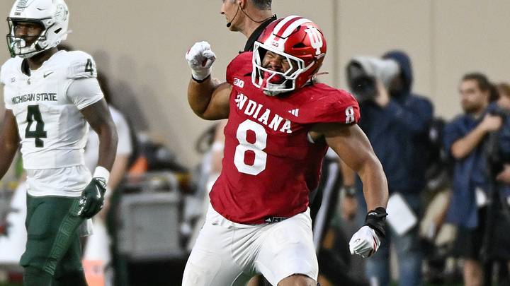 Oct 18, 2025; Bloomington, Indiana, USA; Indiana Hoosiers linebacker Rolijah Hardy (21) and defensive lineman Stephen Daley (8) celebrate after a defensive play during the second half against the Michigan State Spartans at Memorial Stadium. Mandatory Credit: Robert Goddin-Imagn Images