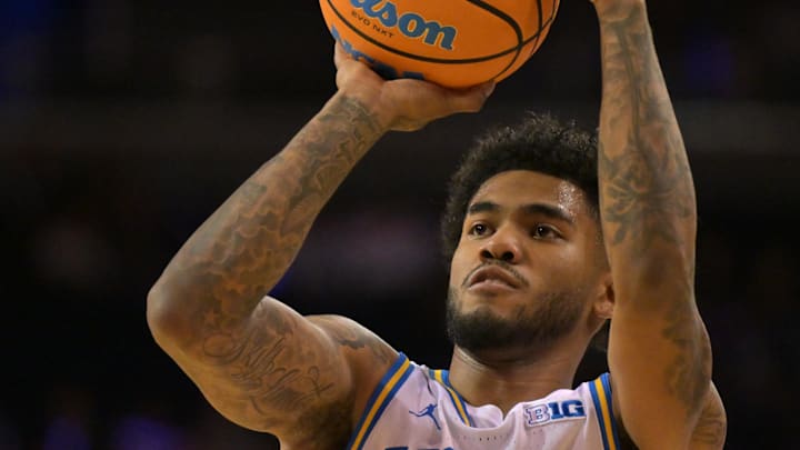 Feb 7, 2026; Los Angeles, California, USA;  UCLA Bruins guard Donovan Dent (2) shoots the ball in the first half against the Washington Huskies at Pauley Pavilion presented by Wescom Financial. Mandatory Credit: Jayne Kamin-Oncea-Imagn Images