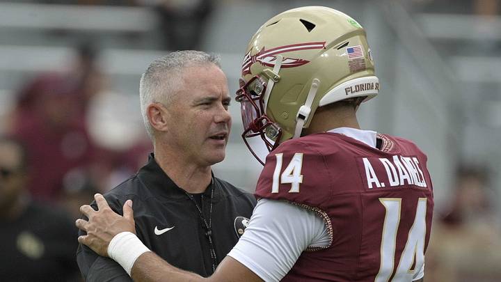 Aug 29, 2026; Tallahassee, Florida, USA; Florida State head coach Mike Norvell talks with quarterback Ashton Daniels (14) during warmups prior to a game against New Mexico State at Doak S. Campbell Stadium. Mandatory Credit: Melina Myers-Imagn Images Aug 29, 2026; Tallahassee, Florida, USA; Florida State head coach Mike Norvell talks with quarterback Ashton Daniels (14) during warmups prior to a game against New Mexico State at Doak S. Campbell Stadium. Mandatory Credit: Melina Myers-Imagn Images