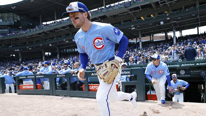 May 22, 2026; Chicago, Illinois, USA; Chicago Cubs second baseman Nico Hoerner (2) runs into the field before a baseball game against the Houston Astros at Wrigley Field. Mandatory Credit: Kamil Krzaczynski-Imagn Images