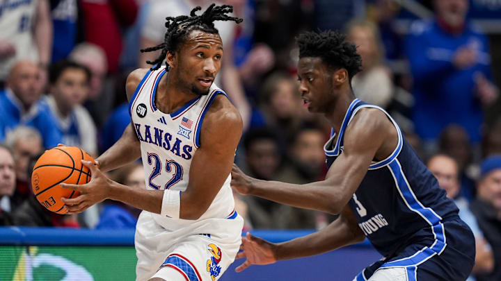 Jan 24, 2026; Columbia, Missouri, USA; Kansas Jayhawks guard Darryn Peterson (22) looks to pass against BYU Cougars forward AJ Dybantsa (3) during the first half at Mizzou Arena. Mandatory Credit: Jay Biggerstaff-Imagn Images