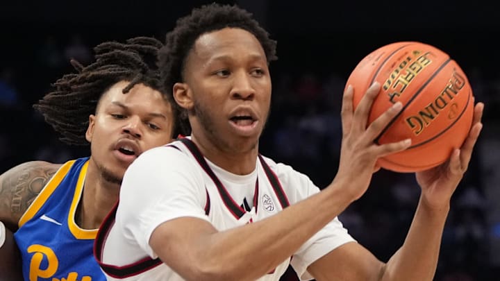 Mar 11, 2026; Charlotte, NC, USA; NC State Wolfpack guard Quadir Copeland (11) with the ball as Pittsburgh Panthers forward Cameron Corhen (2) and Pittsburgh Panthers guard MacAri Moore (21) defend in the second half at Spectrum Center. Mandatory Credit: Bob Donnan-Imagn Images