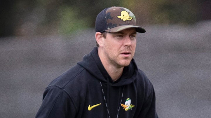 Oregon quarterback Dillon Gabriel throws out a pass as offensive coordinator Will Stein during practice with the Oregon Ducks Tuesday, Aug. 27, 2024, at the Hatfield-Dowlin Complex in Eugene, Ore.