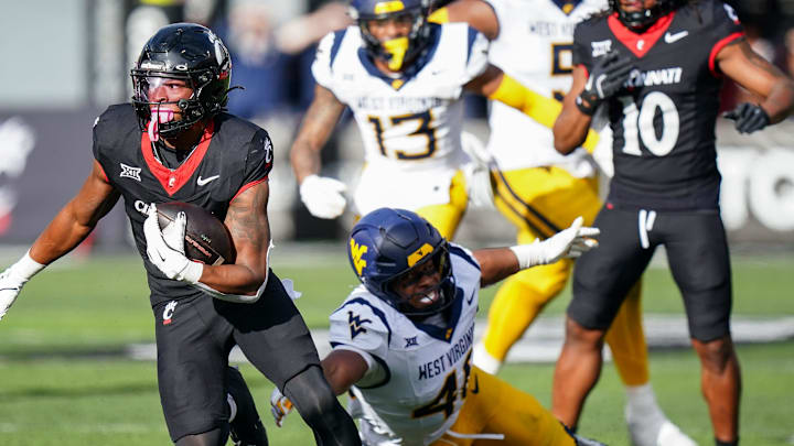 Cincinnati Bearcats running back Evan Pryor (6) runs down the field with the ball in the fourth quarter of a college football game between the Cincinnati Bearcats and West Virginia Mountaineers, Saturday, Nov. 9, 2024, at Nippert Stadium in Cincinnati. Mountaineers won 31-24.