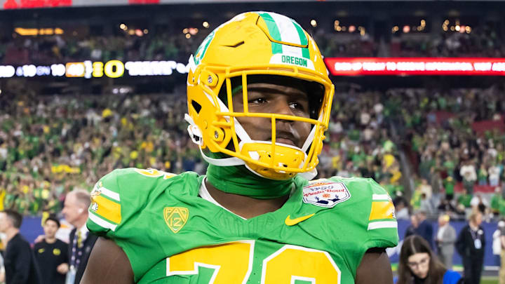 Jan 1, 2024; Glendale, AZ, USA; Oregon Ducks offensive lineman Josh Conerly Jr. (76) against the Liberty Flames during the 2024 Fiesta Bowl at State Farm Stadium. Mandatory Credit: Mark J. Rebilas-Imagn Images