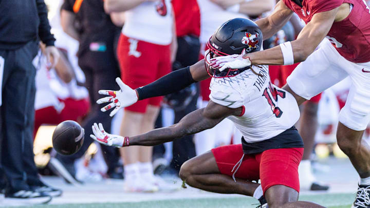 Nov 16, 2024; Stanford, California, USA; Louisville Cardinals defensive back Corey Thornton (14) defends a pass to Stanford Cardinal wide receiver Elic Ayomanor (13) during the third quarter at Stanford Stadium. Mandatory Credit: Bob Kupbens-Imagn Images Nov 16, 2024; Stanford, California, USA; Louisville Cardinals defensive back Corey Thornton (14) defends a pass to Stanford Cardinal wide receiver Elic Ayomanor (13) during the third quarter at Stanford Stadium. Mandatory Credit: Bob Kupbens-Imagn Images