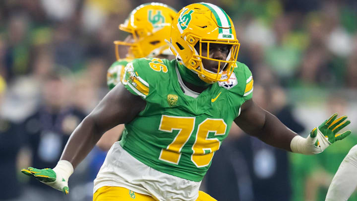 Oregon tackle Josh Conerly Jr. blocks against Liberty in the 2024 Fiesta Bowl.