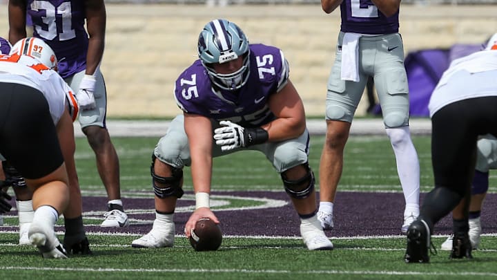 Sep 28, 2024; Manhattan, Kansas, USA; Kansas State Wildcats quarterback Avery Johnson (2) waits for the snap from center Sam Hecht (75) against the Oklahoma State Cowboys during the fourth quarter at Bill Snyder Family Football Stadium. 
