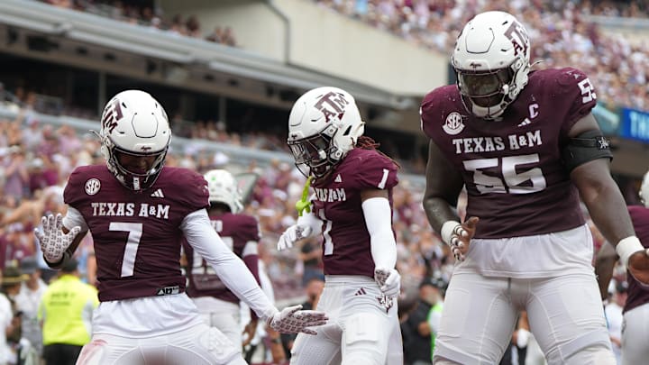 Sep 6, 2025; College Station, Texas, USA; Texas A&M Aggies wide receiver KC Concepcion (7), Texas A&M Aggies wide receiver Mario Craver (1), and Texas A&M Aggies offensive lineman Ar'maj Reed-Adams (55) celebrate after a touchdown during the second quarter against the Utah State Aggies at Kyle Field. Mandatory Credit: Sean Thomas-Imagn Images