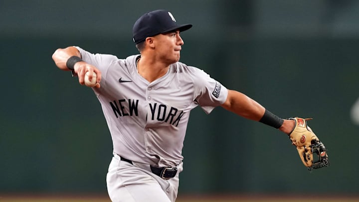 Apr 2, 2024; Phoenix, Arizona, USA; New York Yankees shortstop Anthony Volpe (11) throws to first