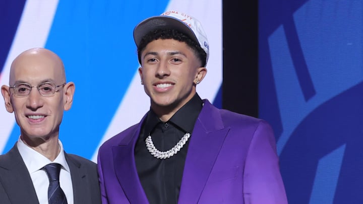 Jun 25, 2025; Brooklyn, NY, USA;  Nique Clifford stands with NBA commissioner Adam Silver after being selected as the 24th pick by the Oklahoma City Thunder in the first round of the 2025 NBA Draft at Barclays Center. Mandatory Credit: Brad Penner-Imagn Images