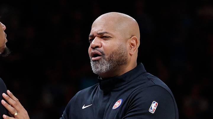 Mar 30, 2026; Oklahoma City, Oklahoma, USA; Detroit Pistons head coach J.B. Bickerstaff holds back forward Ronald Holland II (5) after he received a foul call from an official during the second half at Paycom Center. Mandatory Credit: Alonzo Adams-Imagn Images