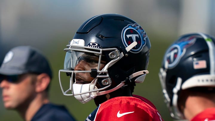 Tennessee Titans quarterback Cam Ward talks with wide receiver Calvin Ridley.