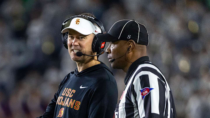 Oct 18, 2025; South Bend, Indiana, USA; Southern California Trojans head coach Lincoln Riley talks to an official during the first half against the Notre Dame Fighting Irish at Notre Dame Stadium. Mandatory Credit: Michael Caterina-Imagn Images Oct 18, 2025; South Bend, Indiana, USA; Southern California Trojans head coach Lincoln Riley talks to an official during the first half against the Notre Dame Fighting Irish at Notre Dame Stadium. Mandatory Credit: Michael Caterina-Imagn Images