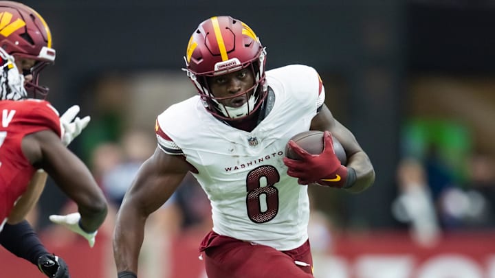 Sep 29, 2024; Glendale, Arizona, USA; Washington Commanders running back Brian Robinson Jr. (8) against the Arizona Cardinals in the first half at State Farm Stadium. Mandatory Credit: Mark J. Rebilas-Imagn Images Sep 29, 2024; Glendale, Arizona, USA; Washington Commanders running back Brian Robinson Jr. (8) against the Arizona Cardinals in the first half at State Farm Stadium. Mandatory Credit: Mark J. Rebilas-Imagn Images