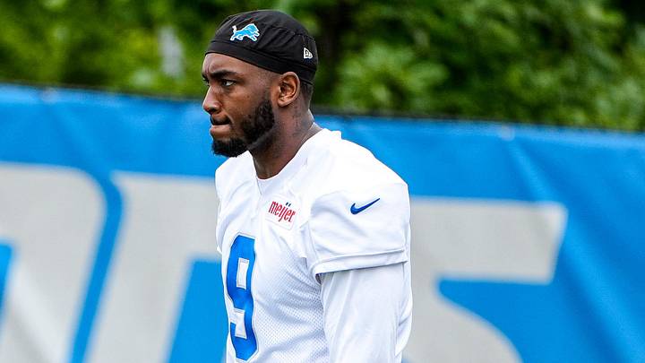 Detroit Lions defensive end Derrick Moore (9) walks onto the field before practice during minicamp Detroit Lions defensive end Derrick Moore (9) walks onto the field before practice during minicamp