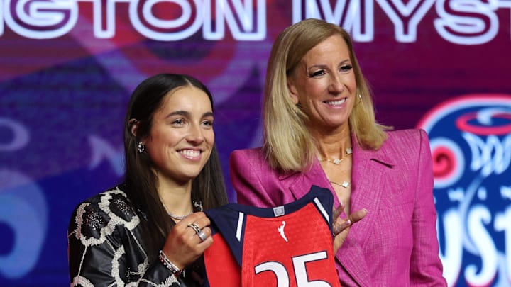 Georgia Amoore poses with WNBA commissioner Cathy Engelbert after being selected with the number six overall pick to the Washington Mystics.