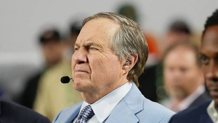 Jan 19, 2026; Miami Gardens, FL, USA; TV analyst Bill Belichick watches the Miami Hurricanes play the Indiana Hoosiers during the first half of the College Football Playoff National Championship game at Hard Rock Stadium. Mandatory Credit: Kirby Lee-Imagn Images Jan 19, 2026; Miami Gardens, FL, USA; TV analyst Bill Belichick watches the Miami Hurricanes play the Indiana Hoosiers during the first half of the College Football Playoff National Championship game at Hard Rock Stadium. Mandatory Credit: Kirby Lee-Imagn Images