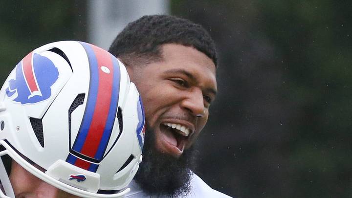 Bills defensive line Ed Oliver jokingly tries to strip the ball from tight end Jackson Hawes as they warm up before day two of Buffalo Bills training camp at St. John Fisher University Thursday, July 30, 2026 in Pittsford. Bills defensive line Ed Oliver jokingly tries to strip the ball from tight end Jackson Hawes as they warm up before day two of Buffalo Bills training camp at St. John Fisher University Thursday, July 30, 2026 in Pittsford.