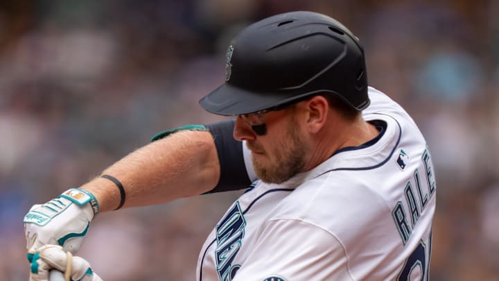 Seattle Mariners right fielder Luke Raley hits a double during a game against the San Diego Padres on Aug. 27 at T-Mobile Park.