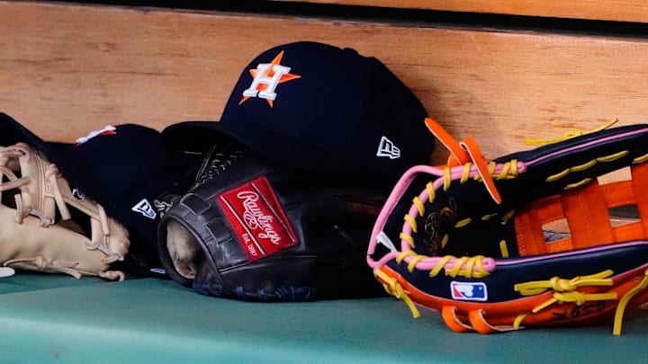 May 16, 2022; Boston, Massachusetts, USA;  A general view of gloves and Houston Astros hats prior to the game against the Boston Red Sox at Fenway Park.