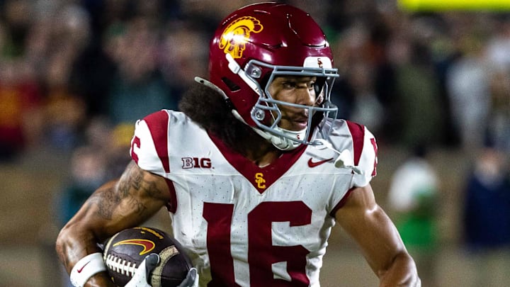 Oct 18, 2025; South Bend, Indiana, USA;  Southern California Trojans wide receiver Tanook Hines (16) runs the ball against the Notre Dame Fighting Irish during the first half  at Notre Dame Stadium. Mandatory Credit: Michael Caterina-Imagn Images