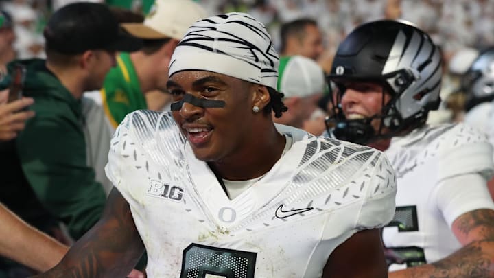 Sep 27, 2025; University Park, Pennsylvania, USA; Oregon Ducks running back Jordon Davison (0) reacts after defeating the Penn State Nittany Lions at Beaver Stadium. Mandatory Credit: Matthew O'Haren-Imagn Images