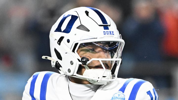Dec 6, 2025; Charlotte, NC, USA; Duke Blue Devils quarterback Darian Mensah (10) looks to throw in the second quarter against the Virginia Cavaliers during the 2025 ACC Championship game at Bank of America Stadium. Mandatory Credit: Bob Donnan-Imagn Images