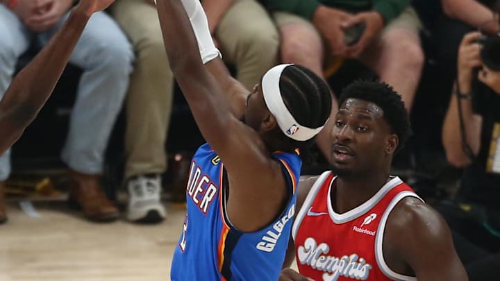 Apr 26, 2025; Memphis, Tennessee, USA; Oklahoma City Thunder guard Shai Gilgeous-Alexander (2) shoots as Memphis Grizzlies guard Vince Williams Jr. (5) defends during the first quarter in Game 4 of the first round at FedExForum. Mandatory Credit: Petre Thomas-Imagn Images Apr 26, 2025; Memphis, Tennessee, USA; Oklahoma City Thunder guard Shai Gilgeous-Alexander (2) shoots as Memphis Grizzlies guard Vince Williams Jr. (5) defends during the first quarter in Game 4 of the first round at FedExForum. Mandatory Credit: Petre Thomas-Imagn Images
