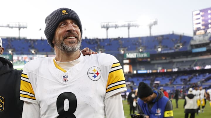 Dec 7, 2025; Baltimore, Maryland, USA; Pittsburgh Steelers head coach Mike Tomlin and quarterback Aaron Rodgers (8) walk off the field after the game against the Baltimore Ravens at M&T Bank Stadium. Mandatory Credit: Peter Casey-Imagn Images