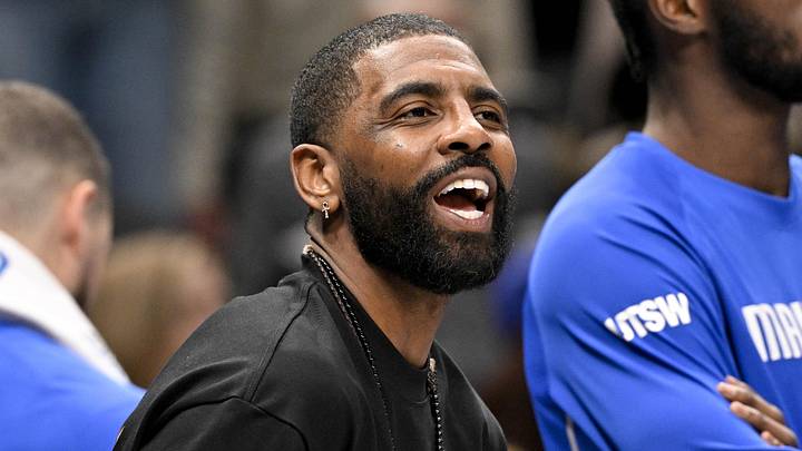 Dec 12, 2025; Dallas, Texas, USA; Dallas Mavericks guard Kyrie Irving (11) jokes with his teammates during the second half against the Brooklyn Nets at the American Airlines Center. Mandatory Credit: Jerome Miron-Imagn Images Dec 12, 2025; Dallas, Texas, USA; Dallas Mavericks guard Kyrie Irving (11) jokes with his teammates during the second half against the Brooklyn Nets at the American Airlines Center. Mandatory Credit: Jerome Miron-Imagn Images
