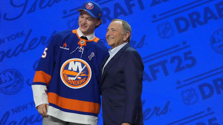 Jun 27, 2025; Los Angeles, California, USA; Matthew Schaefer (left) with NHL commissioner Gary Bettman after being selected as the first overall pick to the New York Islanders in the first round of the 2025 NHL Draft at Peacock Theater. Mandatory Credit: Kirby Lee-Imagn Images