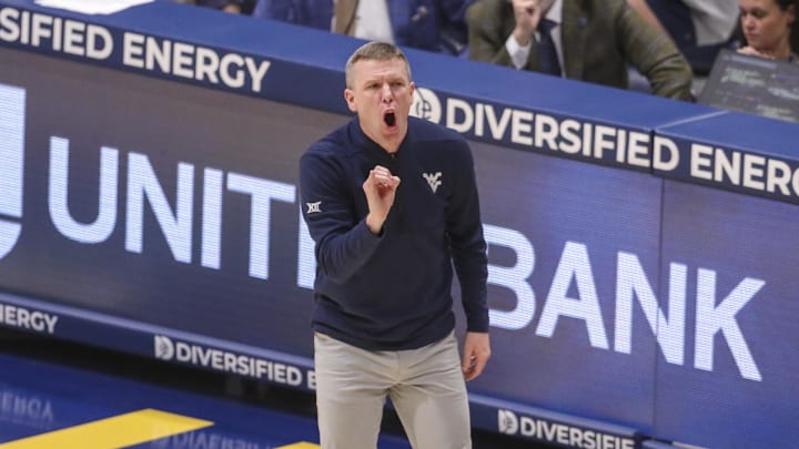 Mar 6, 2026; Morgantown, West Virginia, USA; West Virginia Mountaineers head coach Ross Hodge yells from the sideline during the first half against the UCF Knights at Hope Coliseum. Mandatory Credit: Ben Queen-Imagn Images