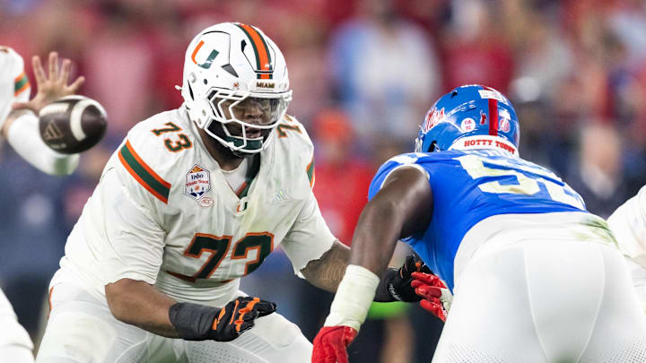 Jan 8, 2026; Glendale, AZ, USA; Miami Hurricanes offensive lineman Anez Cooper (73) against the Mississippi Rebels during the 2026 Fiesta Bowl and semifinal game of the College Football Playoff at State Farm Stadium. Mandatory Credit: Mark J. Rebilas-Imagn Images Jan 8, 2026; Glendale, AZ, USA; Miami Hurricanes offensive lineman Anez Cooper (73) against the Mississippi Rebels during the 2026 Fiesta Bowl and semifinal game of the College Football Playoff at State Farm Stadium. Mandatory Credit: Mark J. Rebilas-Imagn Images