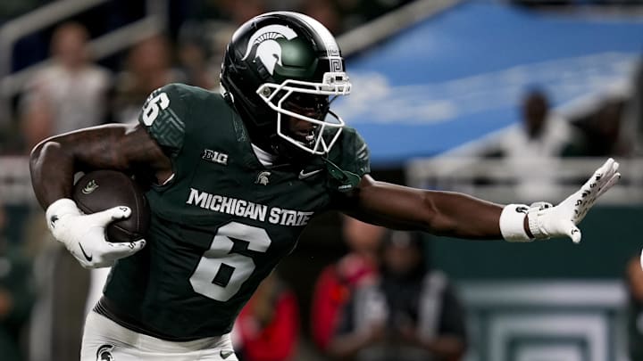 Nov 29, 2025; Detroit, Michigan, USA; Michigan State wide receiver Nick Marsh (6) stiff arms Maryland defensive back Jalen Huskey (22) in the second quarter at Ford Field. Mandatory Credit: Brendan Mullin-Imagn Images Nov 29, 2025; Detroit, Michigan, USA; Michigan State wide receiver Nick Marsh (6) stiff arms Maryland defensive back Jalen Huskey (22) in the second quarter at Ford Field. Mandatory Credit: Brendan Mullin-Imagn Images