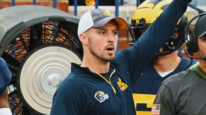 Connor Stalions signals from the sideline