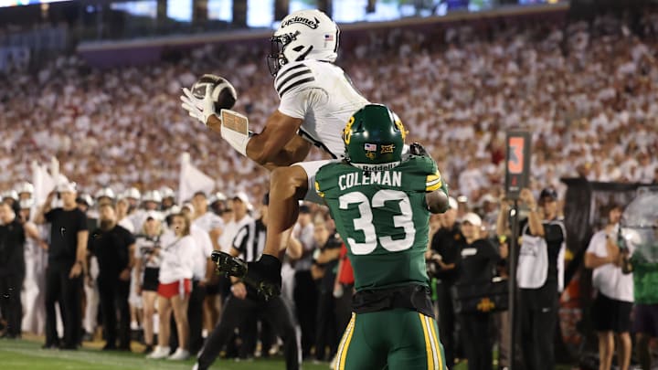 Oct 5, 2024; Ames, Iowa, USA; Iowa State Cyclones wide receiver Jayden Higgins (9) catches a touchdown pass in front of the Baylor Bears safety DJ Coleman (33) at Jack Trice Stadium. 