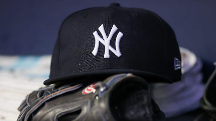 A detailed view of a New York Yankees hat and glove
