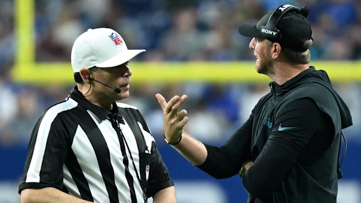 Dec 28, 2025; Indianapolis, Indiana, USA; Jacksonville Jaguars head coach Liam Coen talks to NFL referee Brad Allen during the second half against the Indianapolis Colts at Lucas Oil Stadium. Mandatory Credit: Robert Goddin-Imagn Images