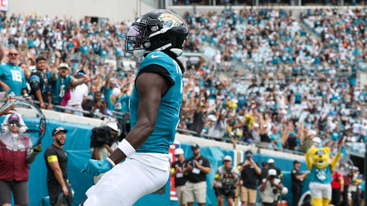 Sep 7, 2025; Jacksonville, Florida, USA; Jacksonville Jaguars wide receiver Brian Thomas Jr. (7) reacts after scoring on a 9-yard touchdown run against the Carolina Panthers during the first half at EverBank Stadium. Mandatory Credit: Nathan Ray Seebeck-Imagn Images