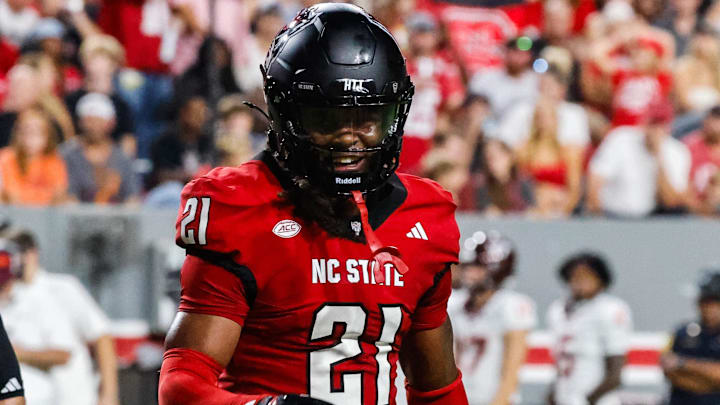 Sep 27, 2025; Raleigh, North Carolina, USA; North Carolina State Wolfpack cornerback Jamel Johnson (21) celebrates during the first half of the game against Virginia Tech Hokies at Carter-Finley Stadium. Mandatory Credit: Jaylynn Nash-Imagn Images Sep 27, 2025; Raleigh, North Carolina, USA; North Carolina State Wolfpack cornerback Jamel Johnson (21) celebrates during the first half of the game against Virginia Tech Hokies at Carter-Finley Stadium. Mandatory Credit: Jaylynn Nash-Imagn Images