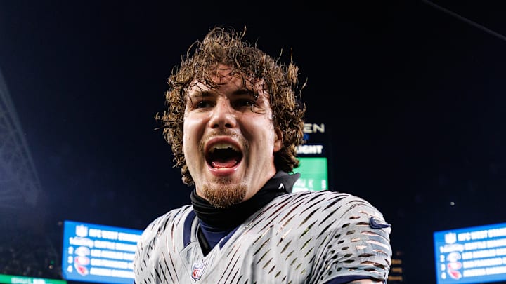 AJ Barner of the Seattle Seahawks celebrates